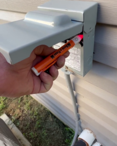 rack-a-tiers ultimate ac sensor being used in an outdoor electrical box