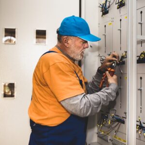 Johnnie Johnson rack-a-tiers' electrician working on an electrical panel